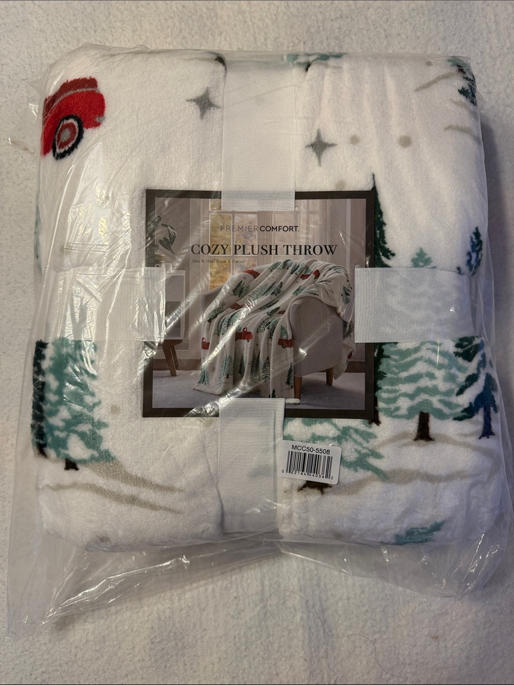 Cozy Plush Throw - White with Green Trees and Red Trucks